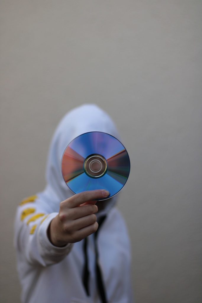 A compact disc held up to the camera A compact disc held up to the camera