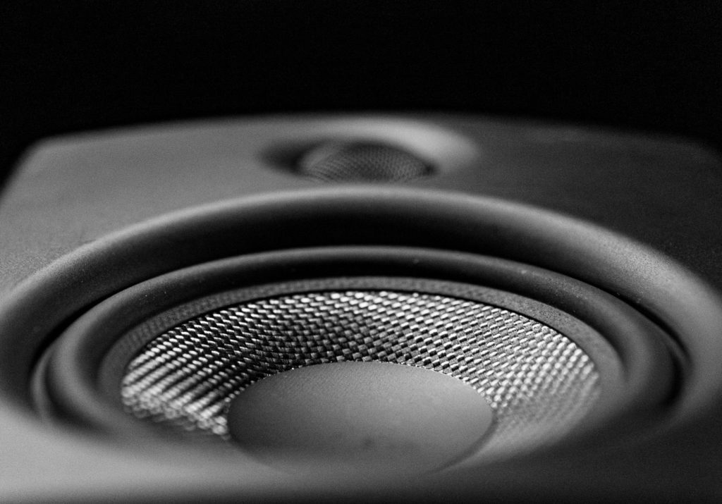 Black and white close-up of a loudspeaker woofer Black and white close-up of a loudspeaker woofer